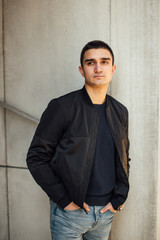 Fashionable man standing outdoors with white background
