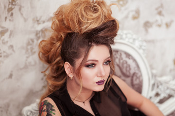 Fashion shiny makeup. Beauty woman with mohawk hairstyle. Blonde sexy model girl with long hair,...