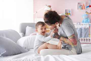 Close up of mother playing with baby