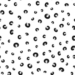 Scattered elements of a rounded shape. Ragged circles painted with a rough brush. Grunge.