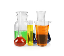Different chemical glassware with color water on white background
