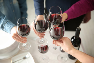 People with red wine at party, closeup