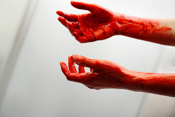 Bloody hands of depressed woman in shower