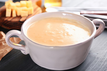Delicious cream soup in pan on table