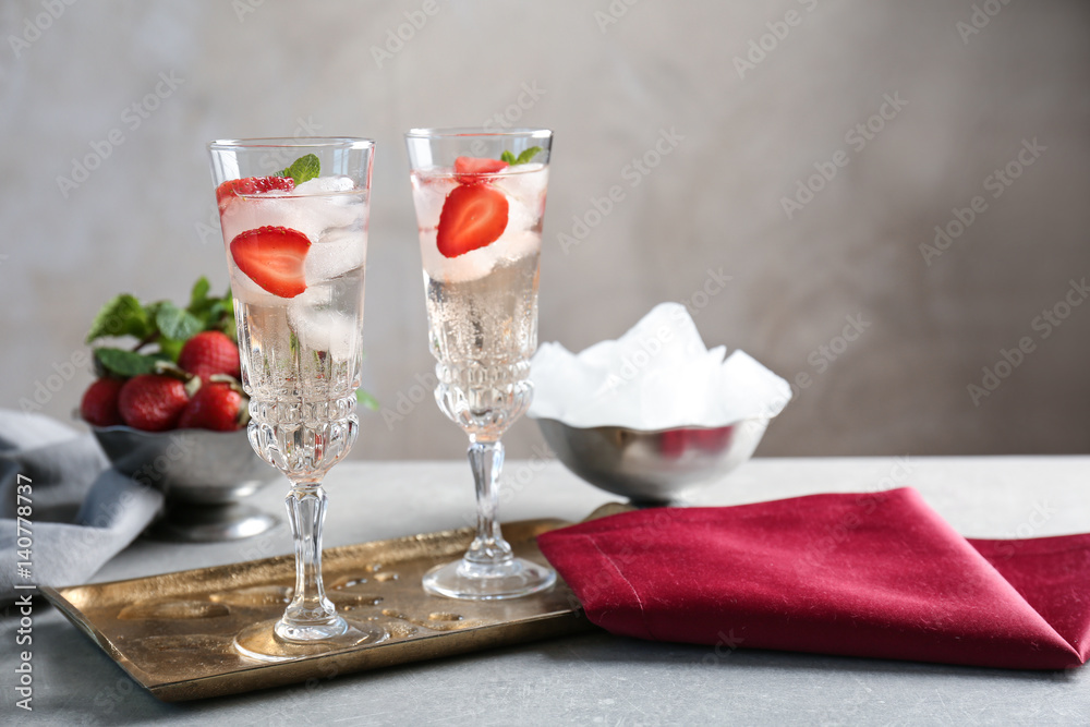 Poster Glasses with delicious wine spritzer on golden tray