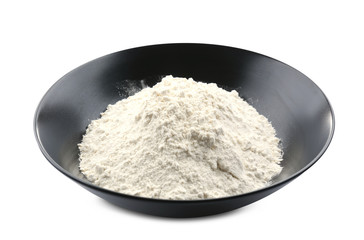 Plate with flour on white background