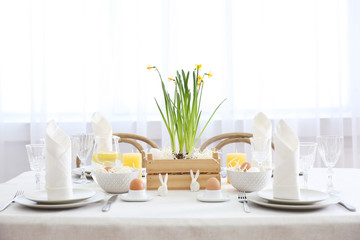 Beautiful Easter table setting in light room