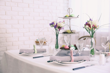 Beautiful Easter table setting in light room