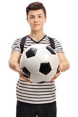 Teenage student with a football