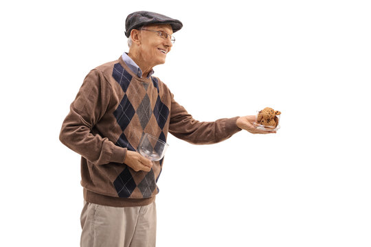 Mature man offering cookies