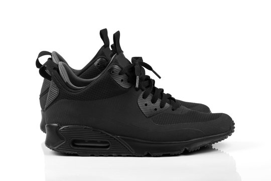 trendy black casual sneakers isolated on white background