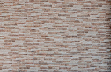 Graphic texture brick wall with coloured stones