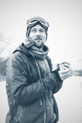 Adventurer drinks coffee at the moment of inspiration