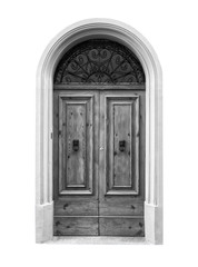 Wooden door in an old Italian house, isolated on white background, clipping path. Black and white.