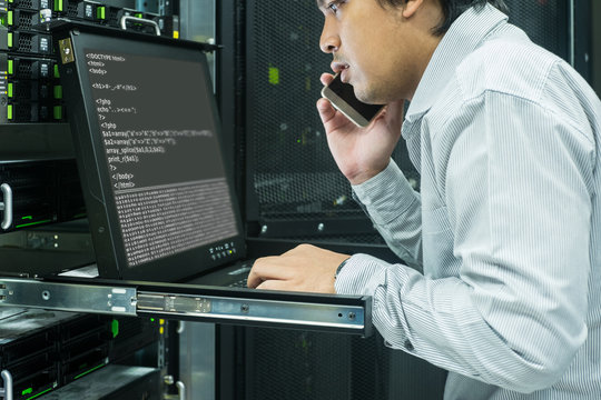system administrator talk telephone to consult in data center