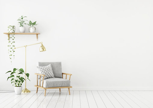 Scandinavian style livingroom with gray fabric armchair, golden lamp and plants on empty white wall background. 3d rendering.