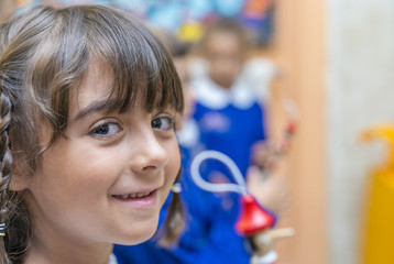 Young girl at school for first elementary day