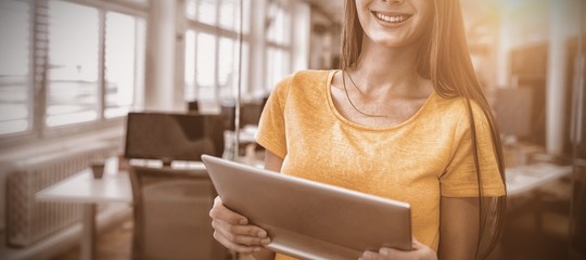 Female business executive using digital tablet