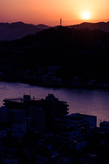 Silhouette of mountains and town at the dawn