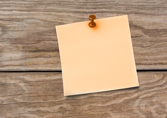Sticky Note against a wood background