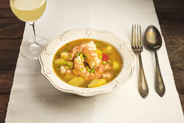 Shrimp and potato dish with wine and copyspace