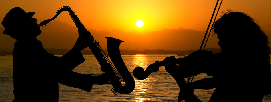 Silhouette couple playing jazz