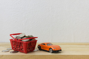 Basket red with car and coins for money concept