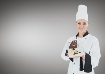 Chef with cake slice against grey background