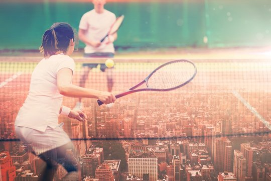 Composite image of tennis players playing a match