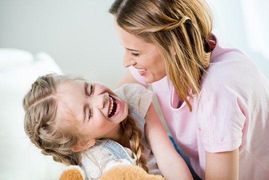 Happy Mother And Daughter Having Fun Together At Home