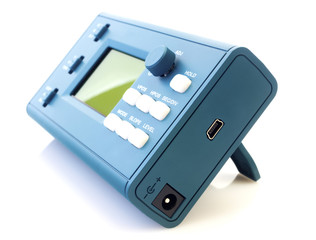 Modern digital signal oscilloscope isolated on white background closeup