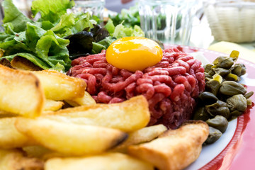 tasty Steak tartare (Raw beef) - classic steak tartare on white plate