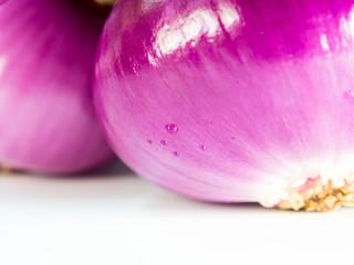 Red onion isolated on a gray background