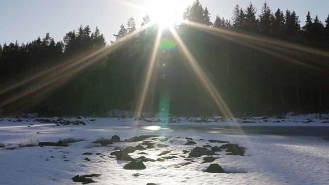 Sunset over the frozen Storsjoen lake, Norway, winter