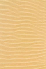 Closeup of sand texture pattern of a beach in the summer