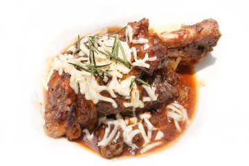 Slow cooked lamb shank with vegetables or stewed lamb isolated on a white background