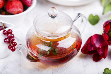 glass teapot with black tea