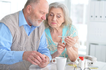 Elderly couple with pills