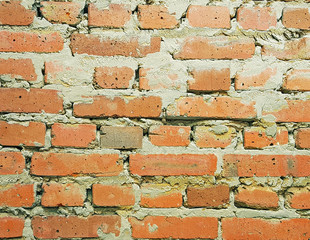 Obraz premium The background of a rough brick wall.