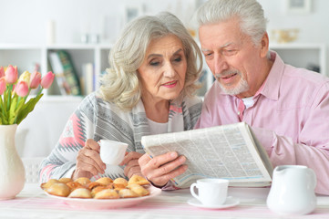 Elderly couple having breakfast