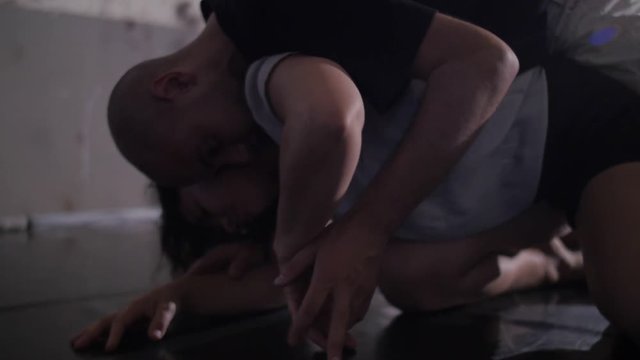 Dancer improvising an intimate dance on the floor