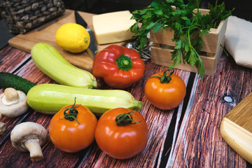 Fototapeta na wymiar Fresh vegetables on a wooden table lie