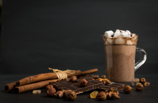 Hot chocolate with marshmallow on the wooden background. Shallow depth of field.