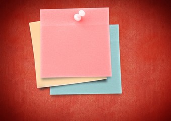 Composite image of colored Sticky Note against red background