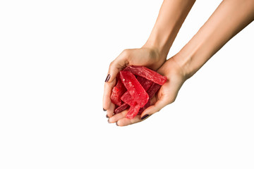nuts and dried fruit in hands on a white background
