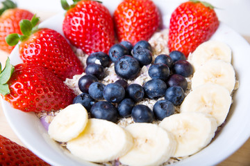 yogurt with strawberry blueberry and banana muesli
