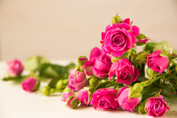 Bouquet of small pink roses on the table