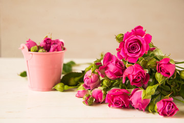 Bouquet of small pink roses on the table