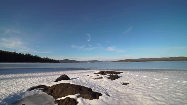 Blue sky over the frozen Storsjoen lake, Norway, winter