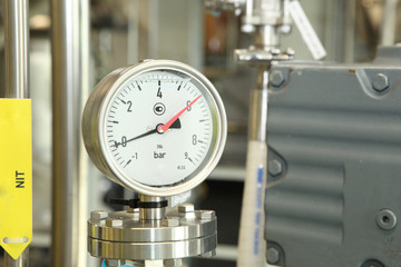 Gates, taps, monometers at the pharmaceutical plant. Open the supply of medicine to the reactor. Manometers in production. Adjustment of air supply and pressure.